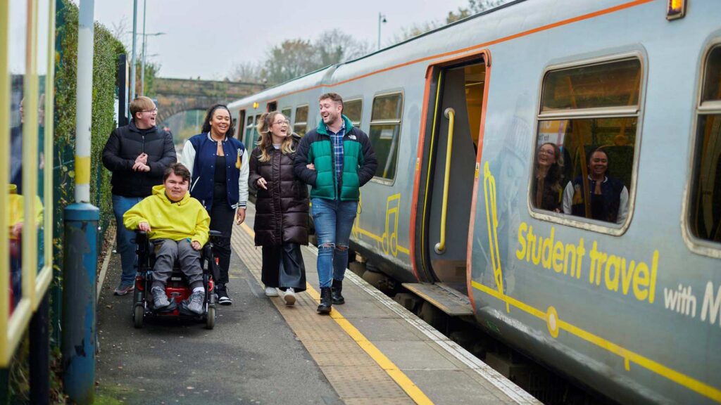 students at a train station