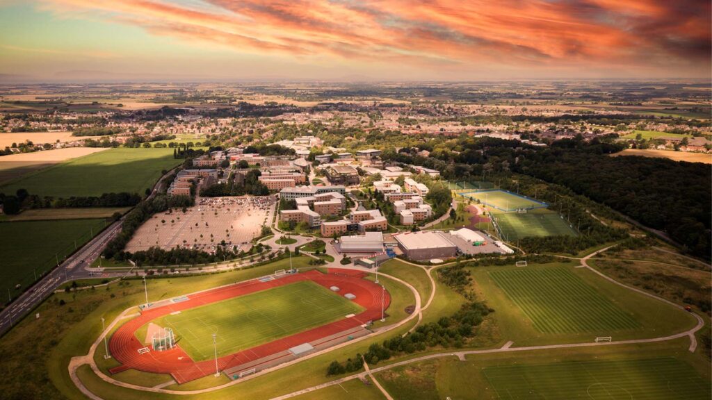 An aerial shot of Edge Hill Sport at sunset, including pitches and the 2.5km conditioning trail.