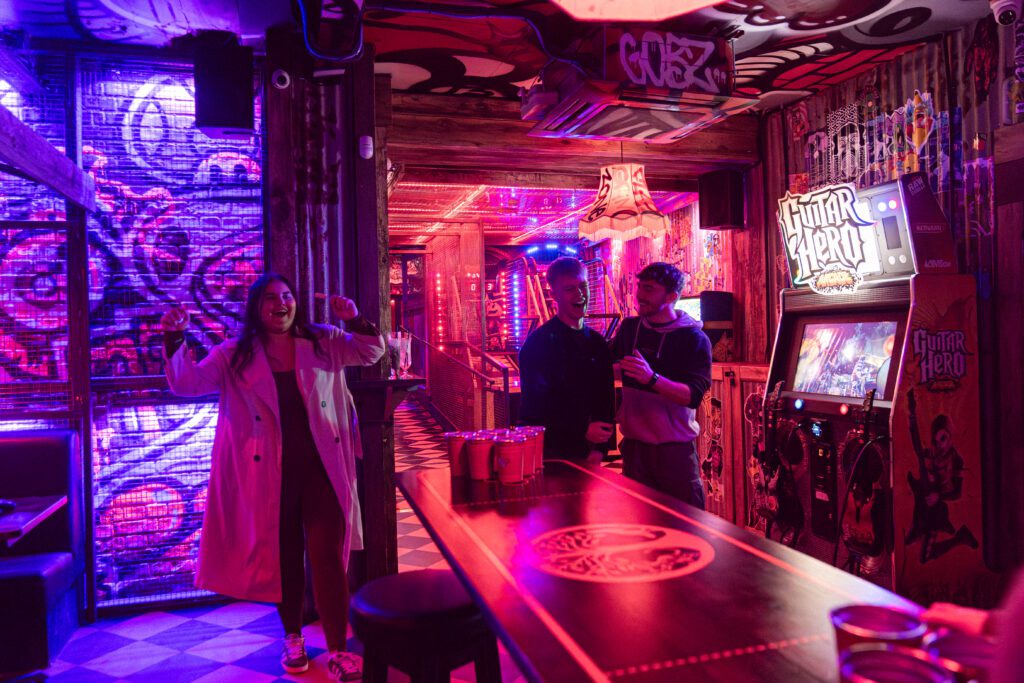 Students playing beer pong in Lime Tyger